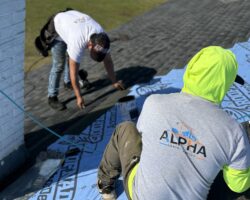 alpha contractors tallahassee guy working on roof 