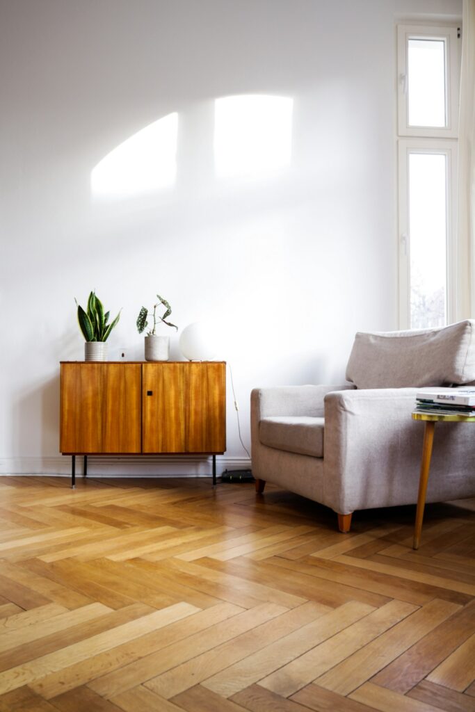 Flooring contractor installing hardwood flooring planks